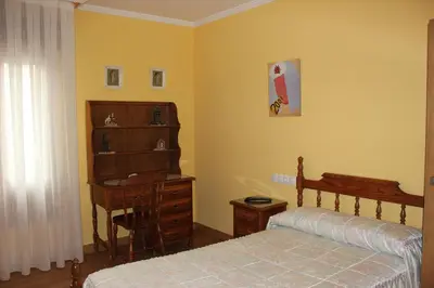 Cama o camas de una habitación en Hostal Casa Perico