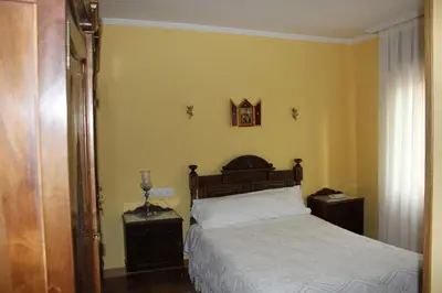 Cama o camas de una habitación en Hostal Casa Perico