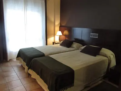 Cama o camas de una habitación en Hotel Villa de Utrillas