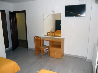 Una televisión o centro de entretenimiento en Hotel Delicias