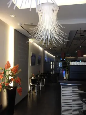 Un restaurante o sitio para comer en Arcohotel