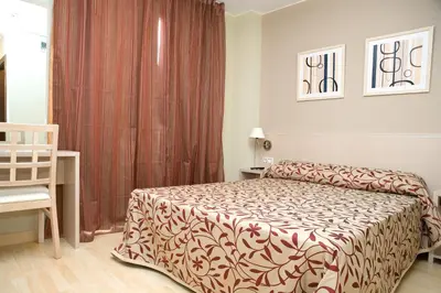 Cama o camas de una habitación en Arcohotel