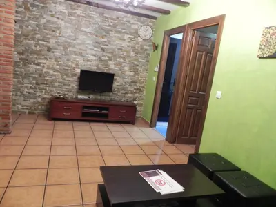 Una televisión o centro de entretenimiento en Turismo Rural Santa Lucia