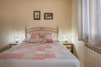 Cama o camas de una habitación en El Rincón de Andrea Apartamentos