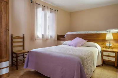 Cama o camas de una habitación en El Rincón de Andrea Apartamentos