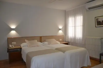 Cama o camas de una habitación en Hotel Balaguer