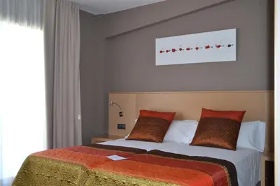 Cama o camas de una habitación en Hotel Vilar Riu de Baix