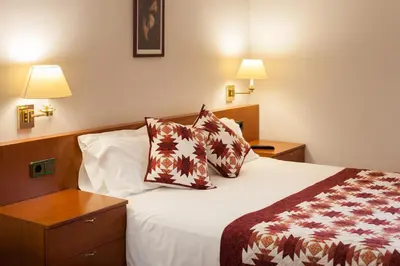 Cama o camas de una habitación en Hostal Restaurant Roma