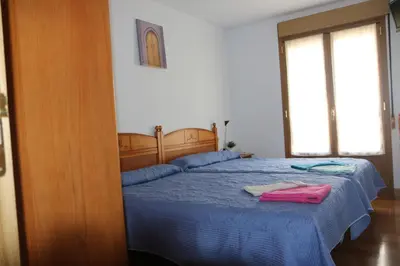 Cama o camas de una habitación en Hostal La Plaza
