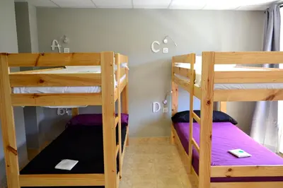 Cama o camas de una habitación en Alda Estella Hostel