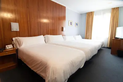 Cama o camas de una habitación en Hotel Beratxa