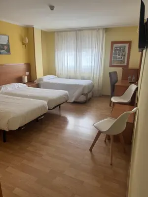 Cama o camas de una habitación en Hostal El Volante