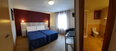 Cama o camas de una habitación en Hotel Casa Escolano