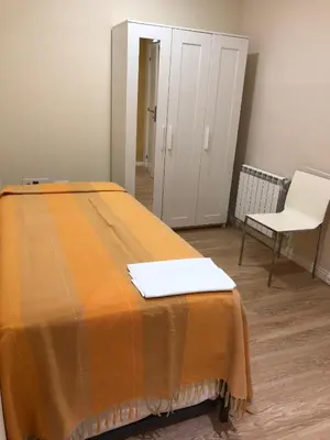 Cama o camas de una habitación en Apartamentos Villava Pamplona