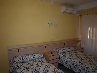 Cama o camas de una habitación en Hostal San Jorge