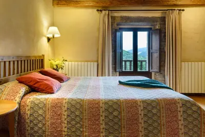 Cama o camas de una habitación en Hotel Akerreta