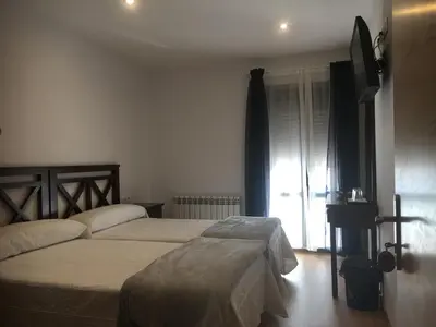 Cama o camas de una habitación en La Casa del Hilario