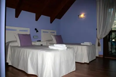 Cama o camas de una habitación en Hostal Rural Casa Parda
