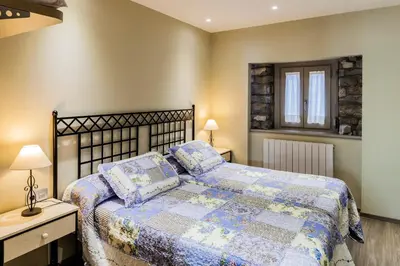 Cama o camas de una habitación en Apartamentos Casa Ríos