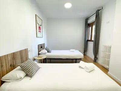Cama o camas de una habitación en VTZ El Balcón a la Basílica II - vistas inmejorables a la Basílica del Pilar!