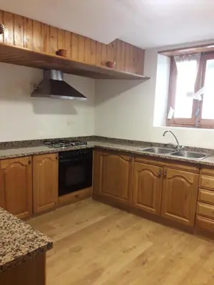Una cocina o zona de cocina en L'Oficial