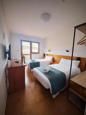 Cama o camas de una habitación en Hostal Legaz