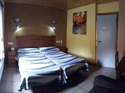 Cama o camas de una habitación en Hotel Sarao 3000