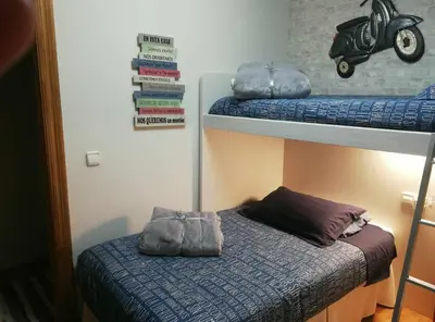 Cama o camas de una habitación en La casa del gatico