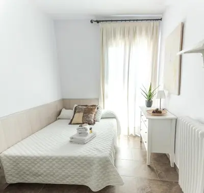Cama o camas de una habitación en La Casa dels Abeuradors