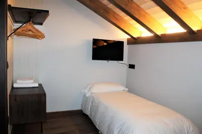 Una televisión o centro de entretenimiento en Casa Perez
