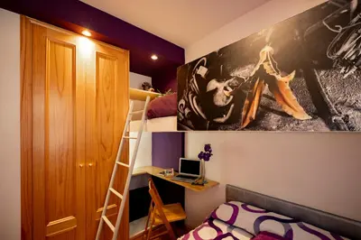 Cama o camas de una habitación en Inmocyma Antigua Casa Chuanina, bajo-Benasque