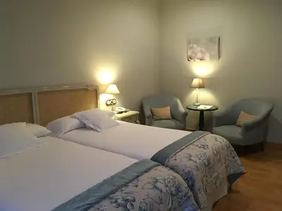 Cama o camas de una habitación en Hotel Villa Monter
