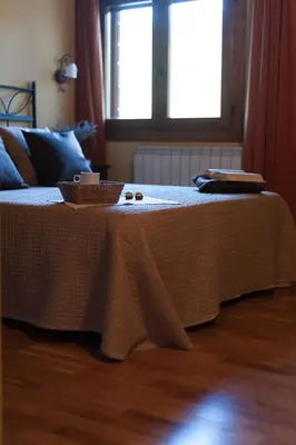 Cama o camas de una habitación en El Tossalet Turismo rural