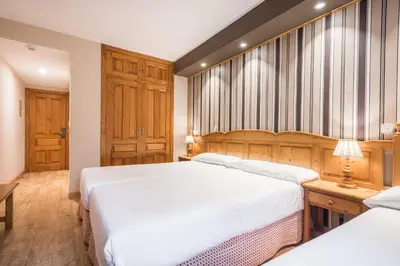 Cama o camas de una habitación en SNÖ Villa de Sallent 3