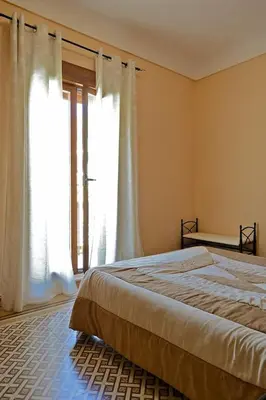 Cama o camas de una habitación en Hostal Las Rumbas