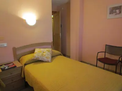 Cama o camas de una habitación en Hostal Las Rumbas