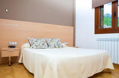 Cama o camas de una habitación en Apartahotel Castejón de Sos