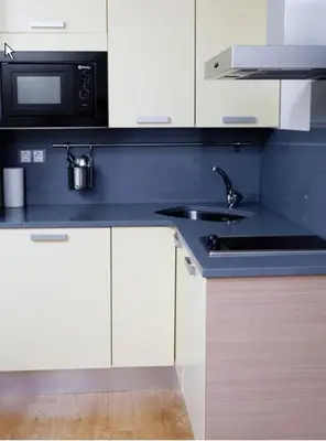 Una cocina o zona de cocina en Apartahotel Castejón de Sos