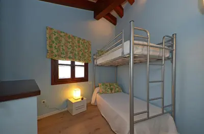 Cama o camas de una habitación en Apartamentos El Palacete de Ainsa