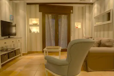 Una televisión o centro de entretenimiento en Apartamentos Rurales El Rapallo