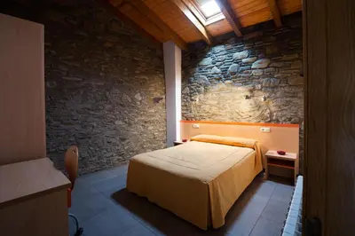 Cama o camas de una habitación en Allotjament Rural Cal Miquel