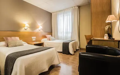 Cama o camas de una habitación en Hotel Casa Jacinto Pamplona