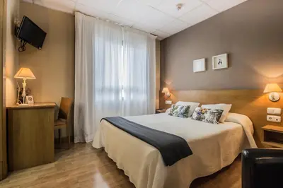 Cama o camas de una habitación en Hotel Casa Jacinto Pamplona