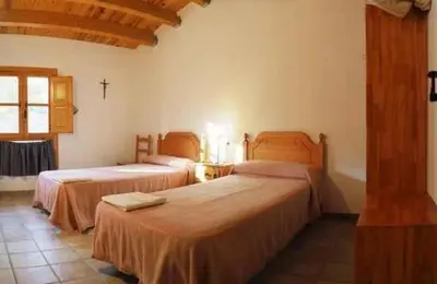 Cama o camas de una habitación en Monasterio El Olivar