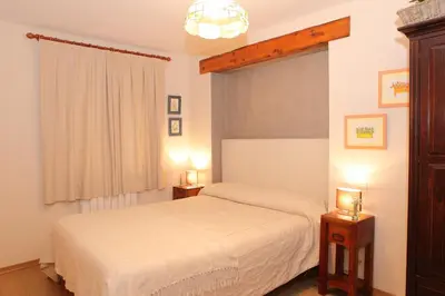 Cama o camas de una habitación en Apartamentos Albá Casa Alquesera