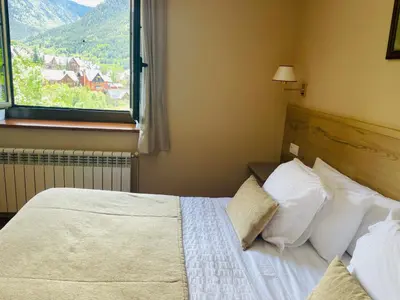 Cama o camas de una habitación en Hostal Escuils