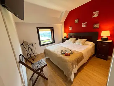 Cama o camas de una habitación en Apartamento Vistas Peña Telera con WIFI