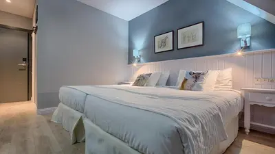 Cama o camas de una habitación en Hotel Ribaeta