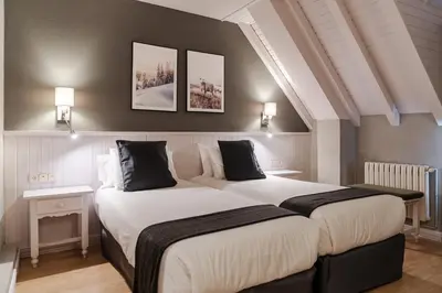 Cama o camas de una habitación en Hotel Ribaeta