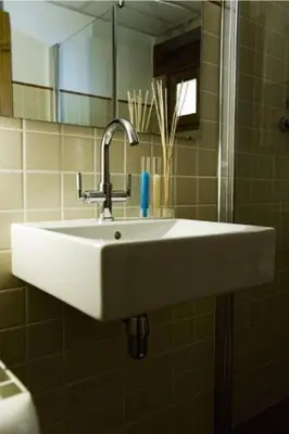 Un baño de Apartamentos Doña Candida